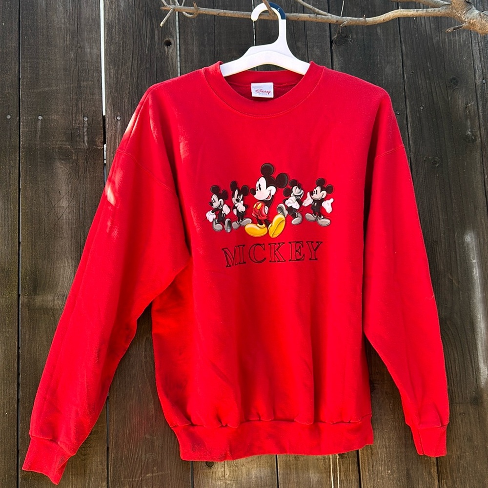 Red Mickey sweater, it does has a stain we tried our best to make it come off.
